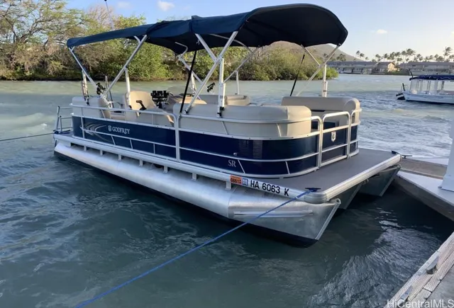 a view of a patio with table and chairs under an umbrella
