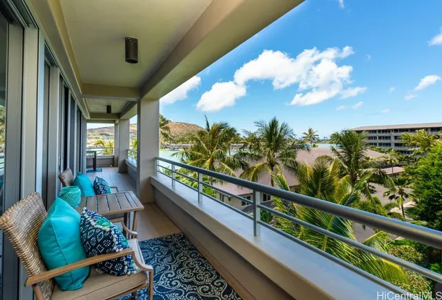 a view of a balcony with furniture