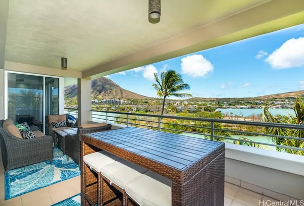 a view of a balcony with chairs