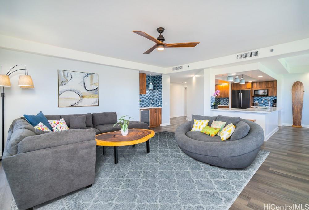 1 Keahole Place, Unit 3512 Honolulu, HI 96825 - Photo 10 of 18 a living room with furniture and a flat screen tv