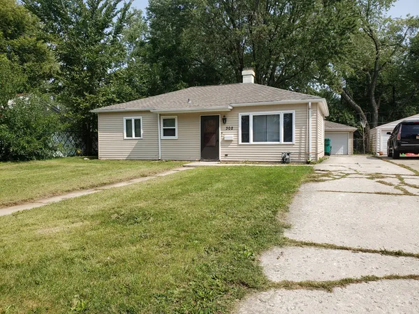 a front view of a house with yard