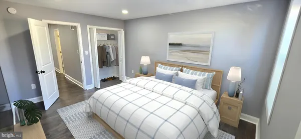 a bedroom with a bed and a mirror