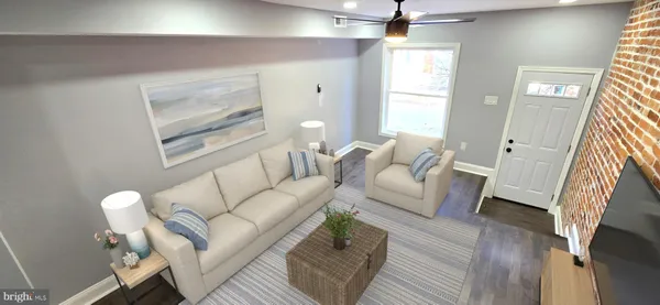 a living room with furniture and a window