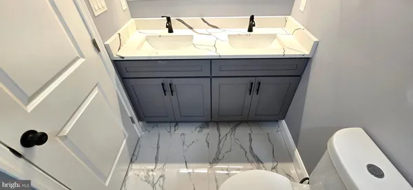 a bathroom with a sink and mirror