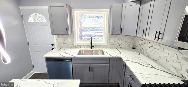 a bathroom with a sink a vanity and a mirror