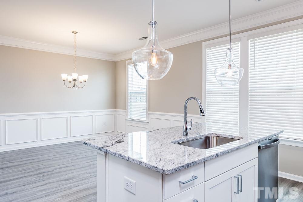 3247 Lynn Road, Unit 19 Raleigh, NC 27613 - Photo 14 of 20 a kitchen with a sink cabinets and window