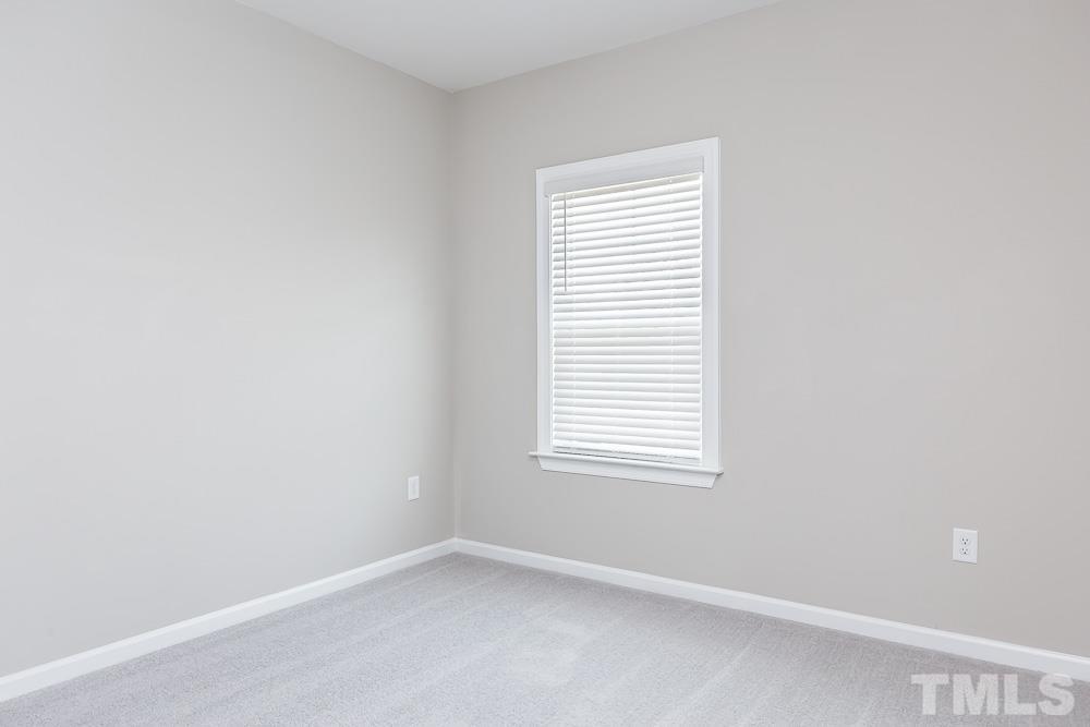 3247 Lynn Road, Unit 19 Raleigh, NC 27613 - Photo 15 of 20 an empty room with a window