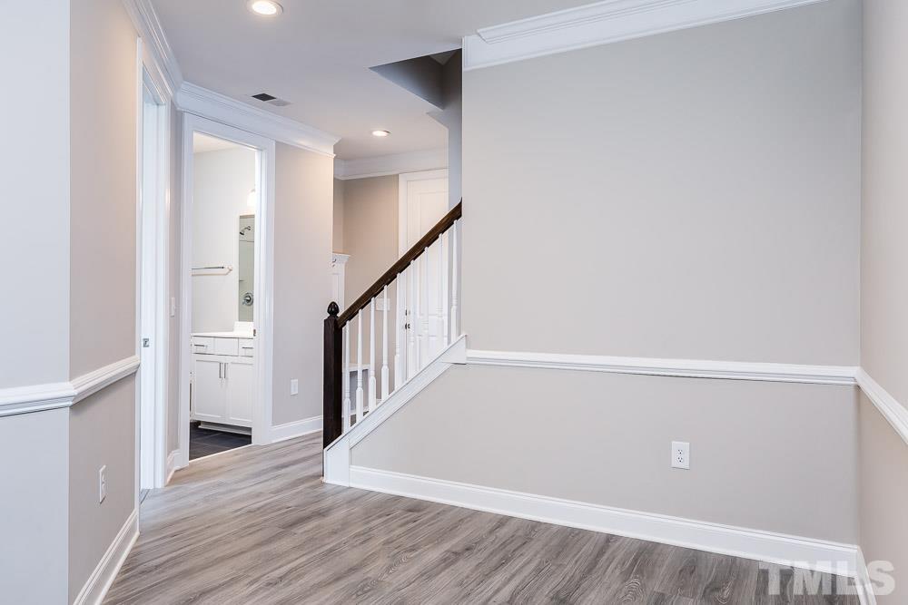 3247 Lynn Road, Unit 19 Raleigh, NC 27613 - Photo 7 of 20 a view of an entryway with wooden floor
