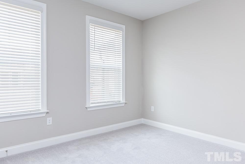 3247 Lynn Road, Unit 19 Raleigh, NC 27613 - Photo 9 of 20 an empty room with a window