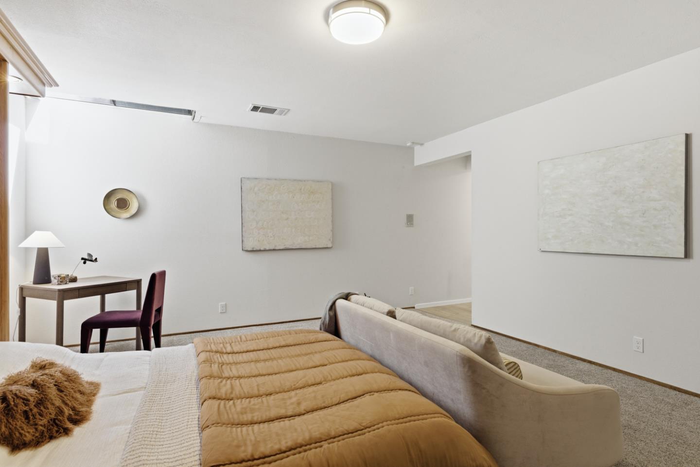 1669 Geary Road Walnut Creek, CA 94597 - Photo 23 of 39 a bedroom with a bed and a chair