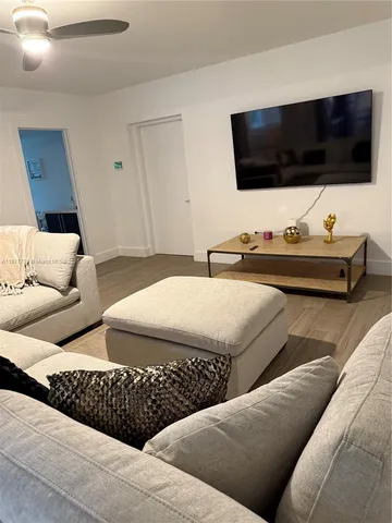 a living room with furniture and a couch