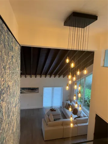 a view of a dinning table and chairs in the patio