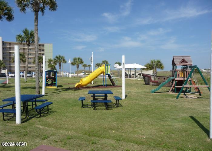 23223 Front Beach Road, Unit 703 Panama City Beach, FL 32413 - Photo 26 of 34 a garden with tall trees