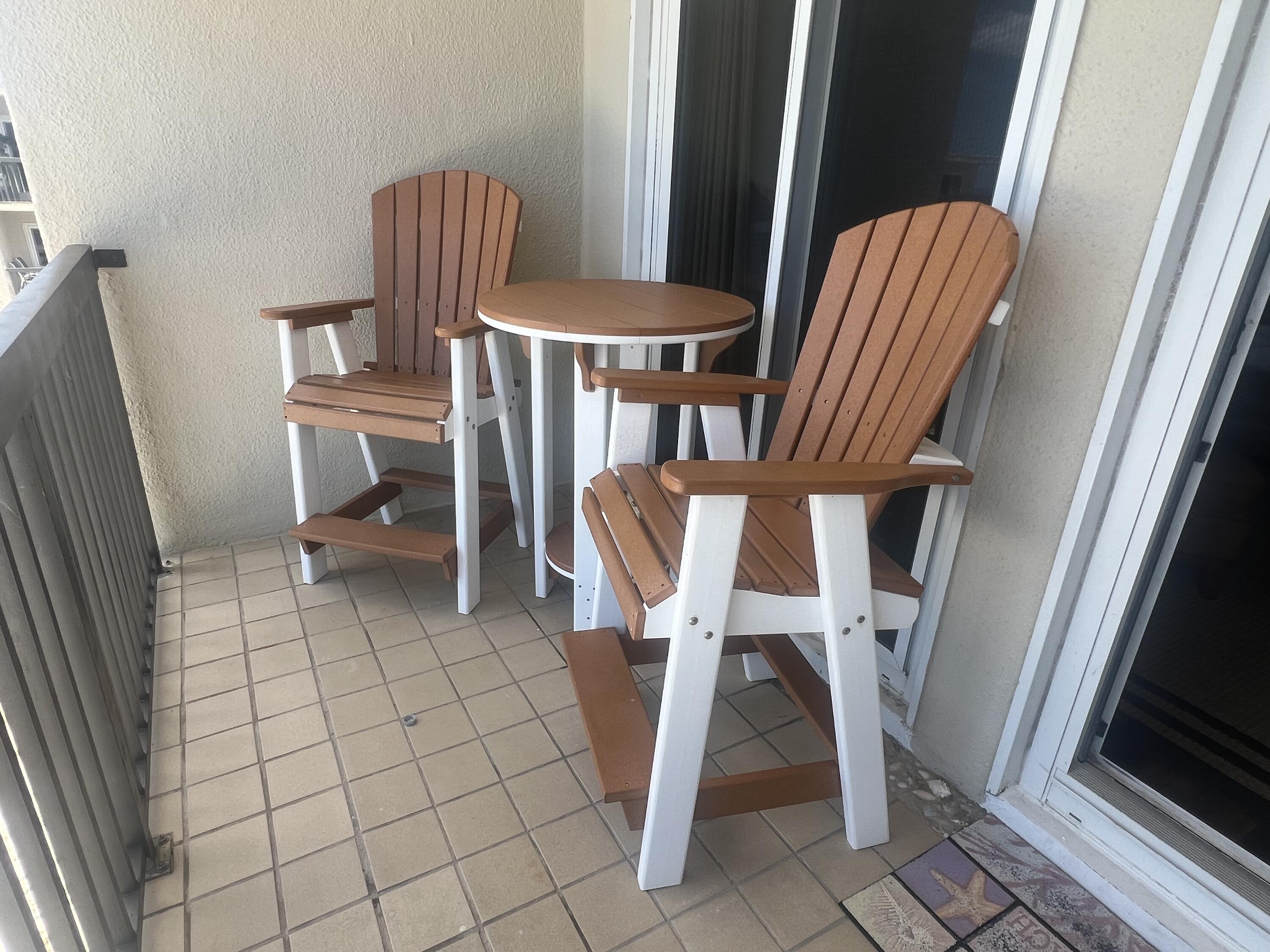23223 Front Beach Road, Unit 703 Panama City Beach, FL 32413 - Photo 5 of 34 a view of an entryway with table and chair
