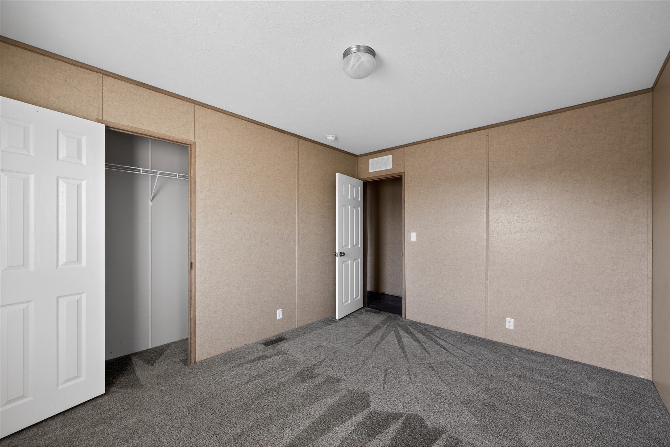 2674 Cotton Gin Road Kyle, TX 78640 - Photo 25 of 30 Unfurnished bedroom featuring ornamental molding, carpet, and a closet