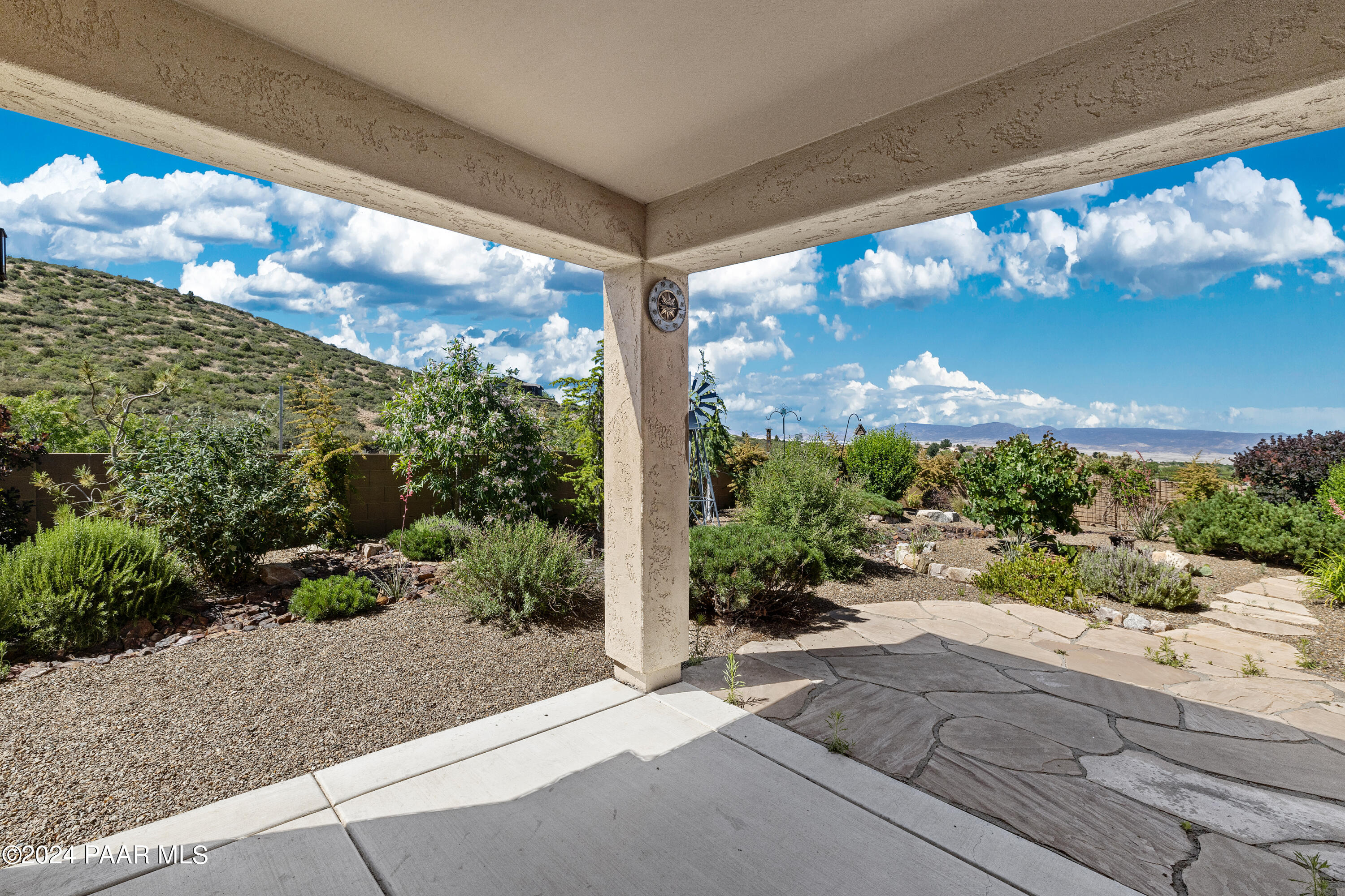 1195 Rigo Ranch Road Prescott Valley, AZ 86314 - Photo 17 of 65 a view of a garden from a window