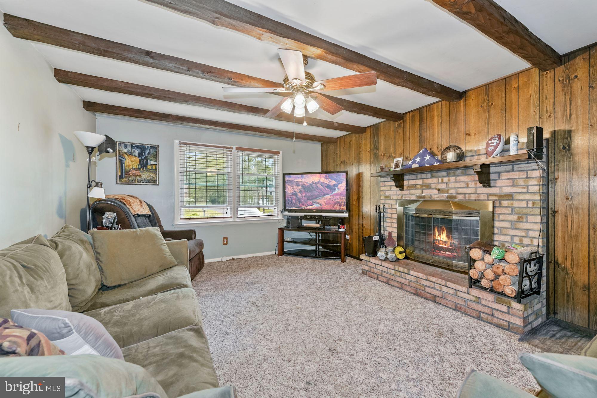 374 Holly Road Marlton, NJ 08053 - Photo 11 of 28 a living room with furniture a fireplace and a flat screen tv