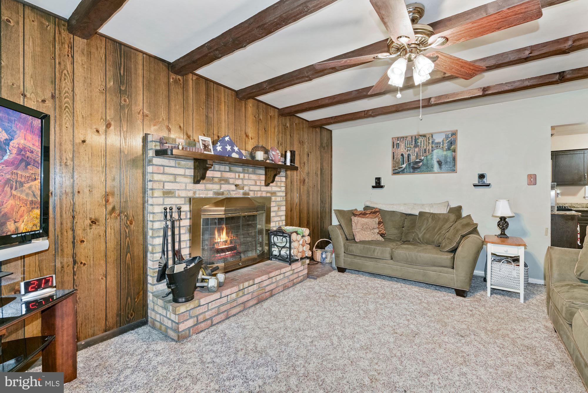 374 Holly Road Marlton, NJ 08053 - Photo 12 of 28 a living room with furniture and a fireplace