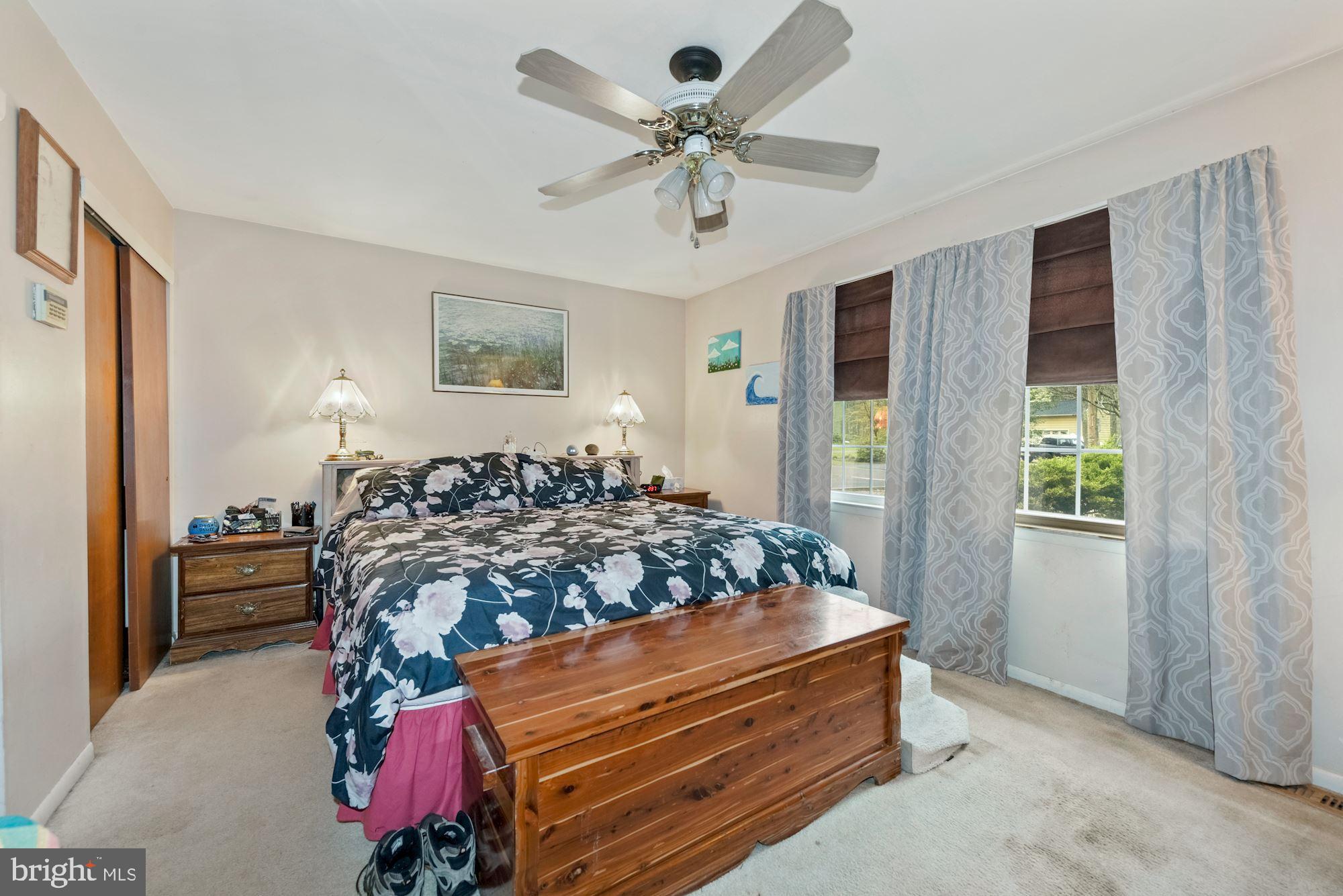 374 Holly Road Marlton, NJ 08053 - Photo 13 of 28 a bed sitting in a bedroom next to a window