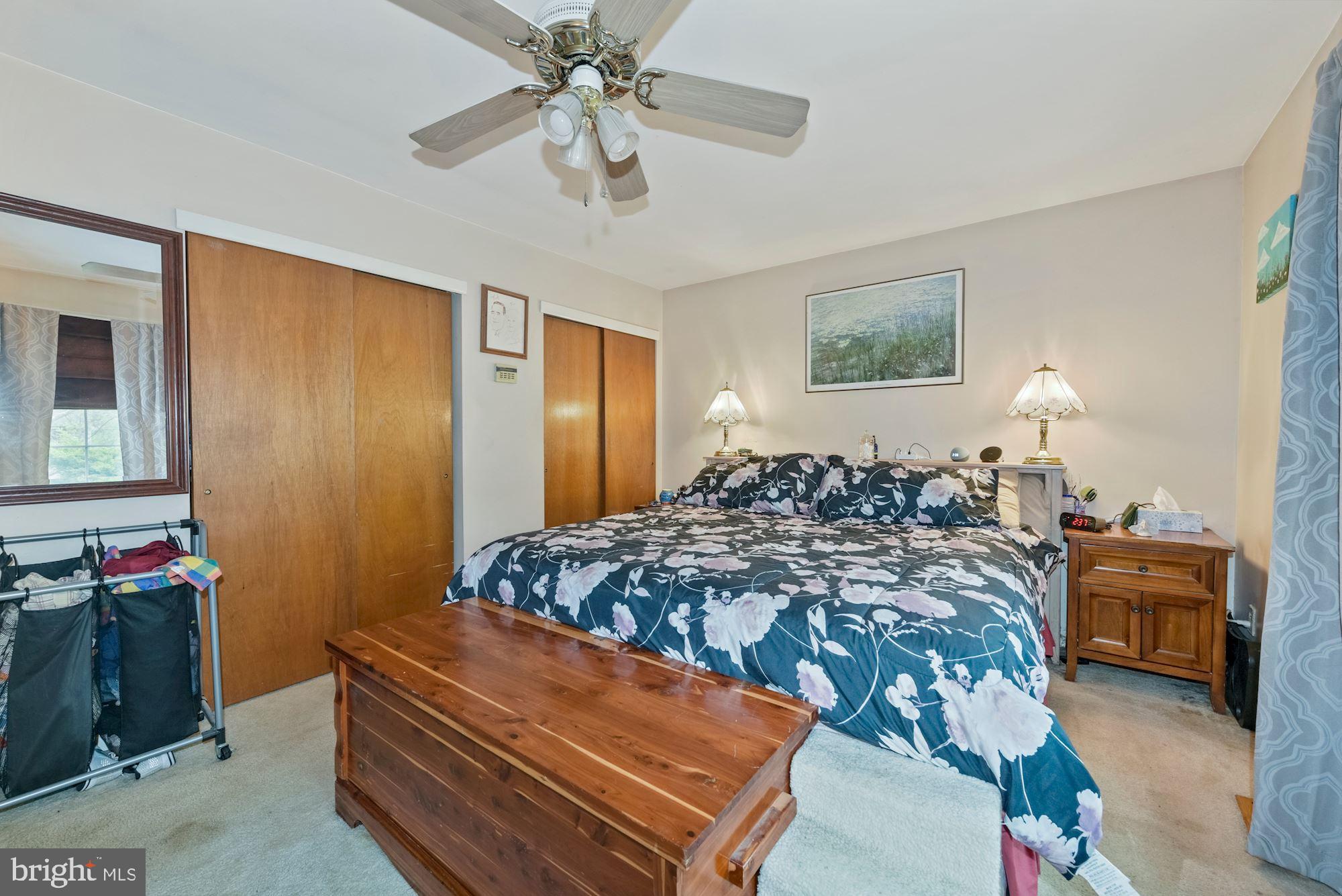 374 Holly Road Marlton, NJ 08053 - Photo 14 of 28 a bedroom with a bed and a chandelier