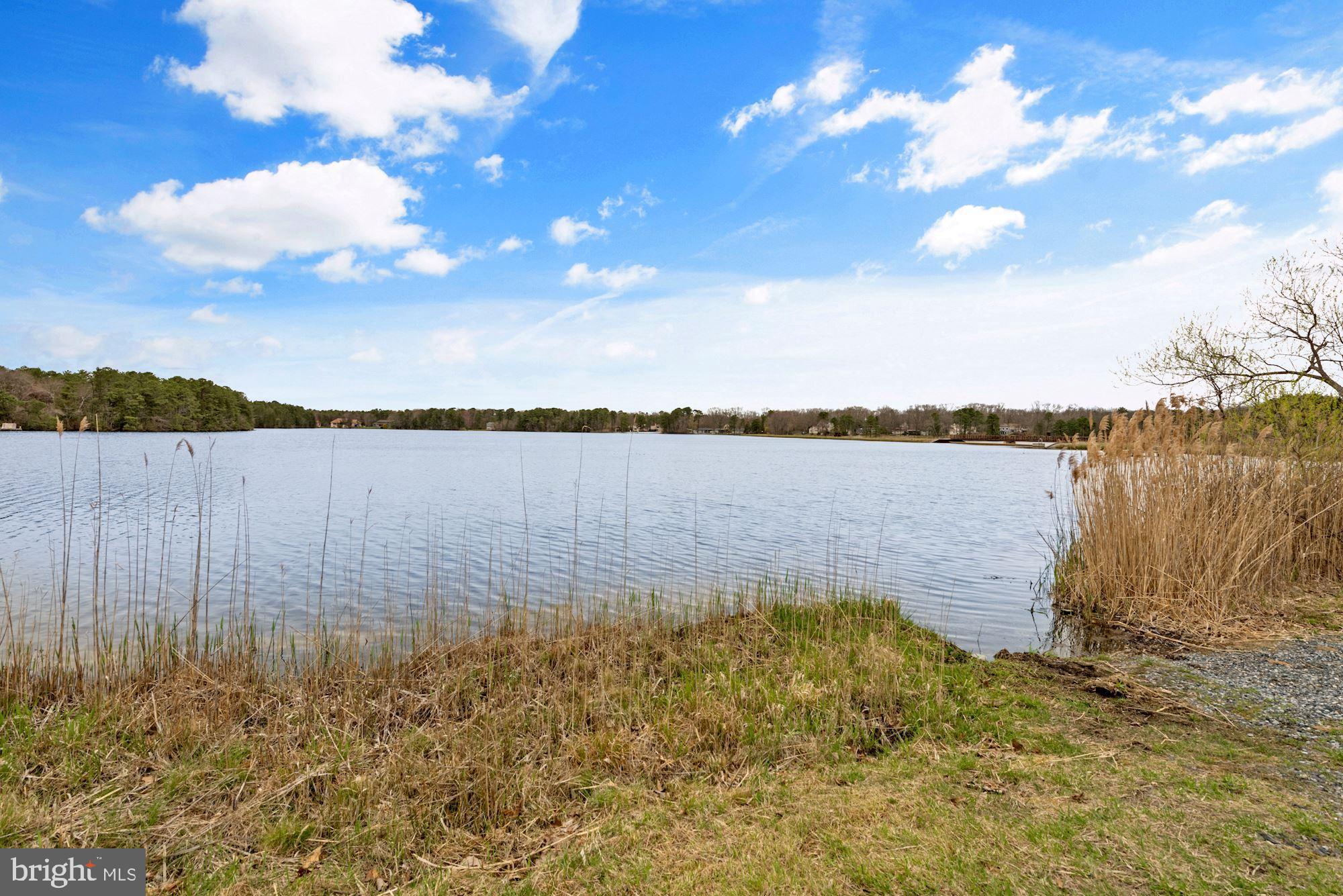 374 Holly Road Marlton, NJ 08053 - Photo 26 of 28 a view of a lake with houses in the back