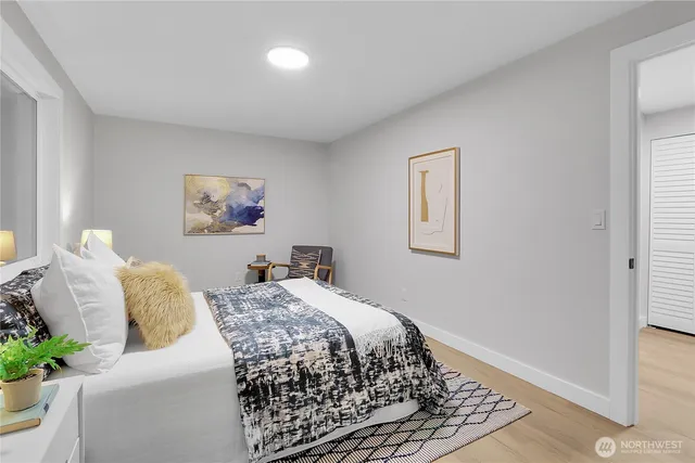 a bedroom with a bed and a couch