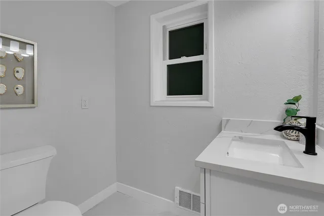 a bathroom with a sink and a toilet