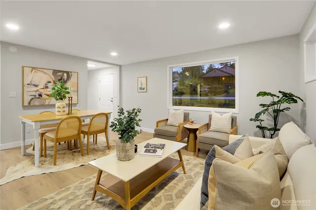 a living room with furniture and a potted plant