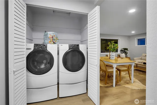 a view of a dining room with furniture and a rug