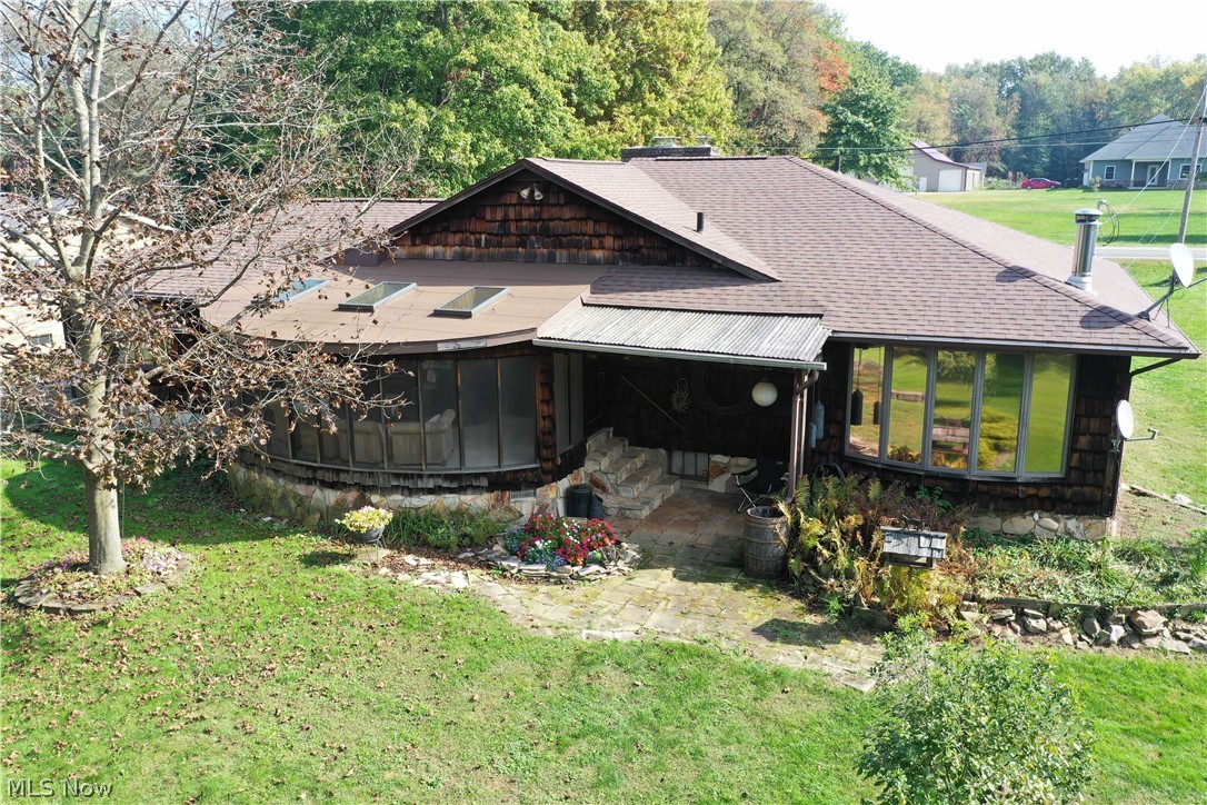 2128 Pressler Road Akron, OH 44312 - Photo 7 of 35 Rearview of the home with a partially covered patio.