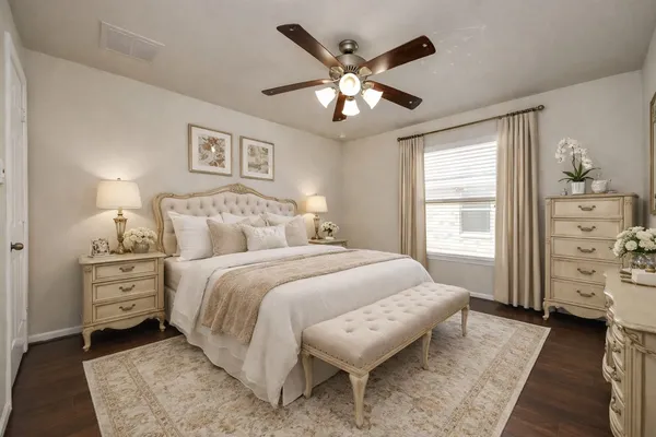 a bedroom with a bed and a chandelier