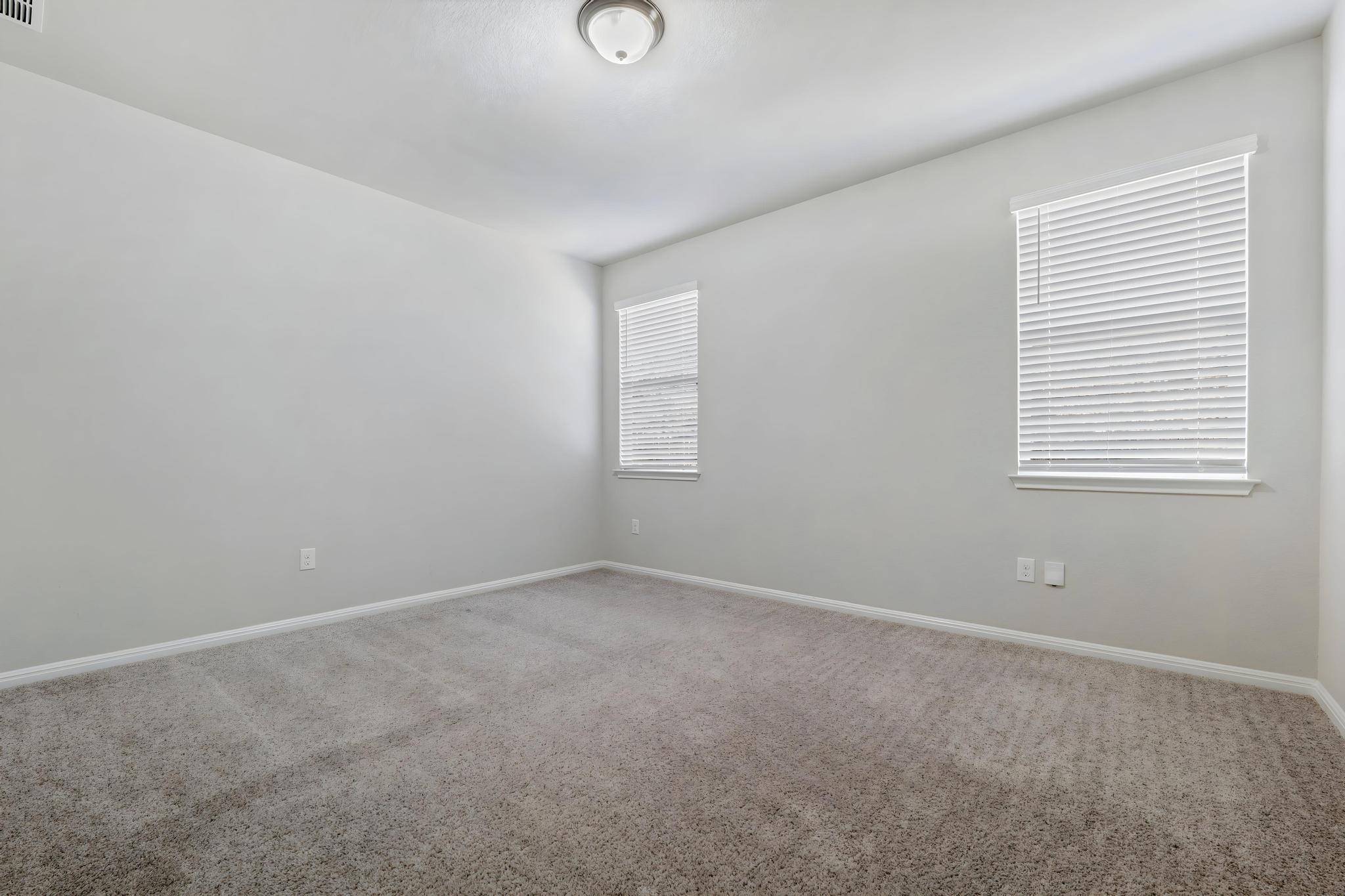 14409 Frankel Loop, Unit 33A Pflugerville, TX 78660 - Photo 14 of 28 an empty room with windows