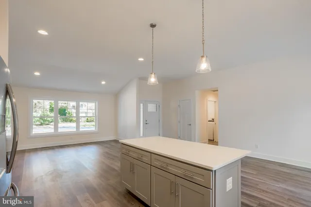 a bathroom with a sink a vanity and a large mirror