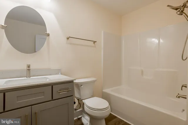 an empty room with a empty space and windows