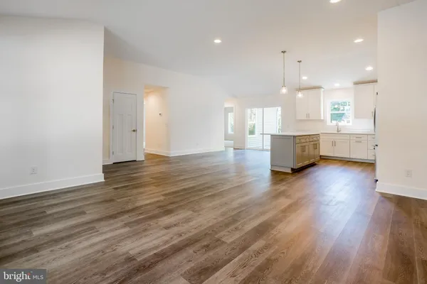 a view of kitchen with cabinets and wooden floor