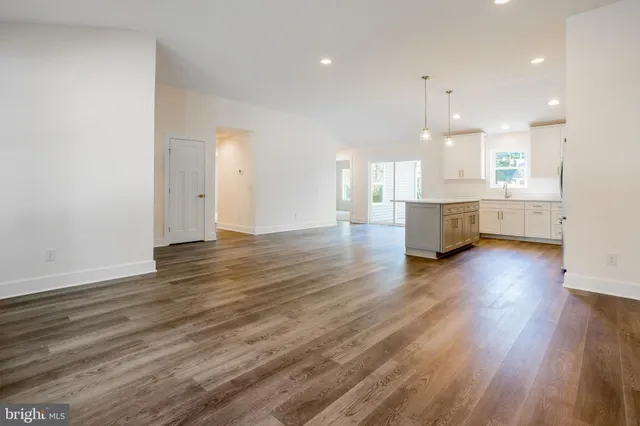 a view of kitchen with cabinets and wooden floor