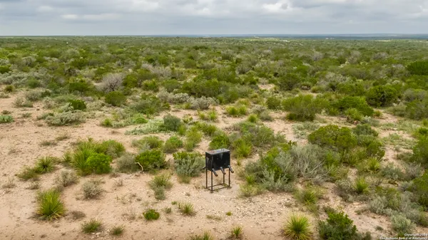 a view of a field with an outdoor space