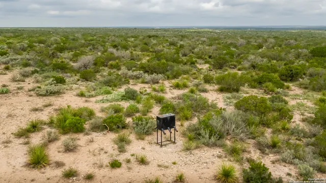 a view of a field with an outdoor space