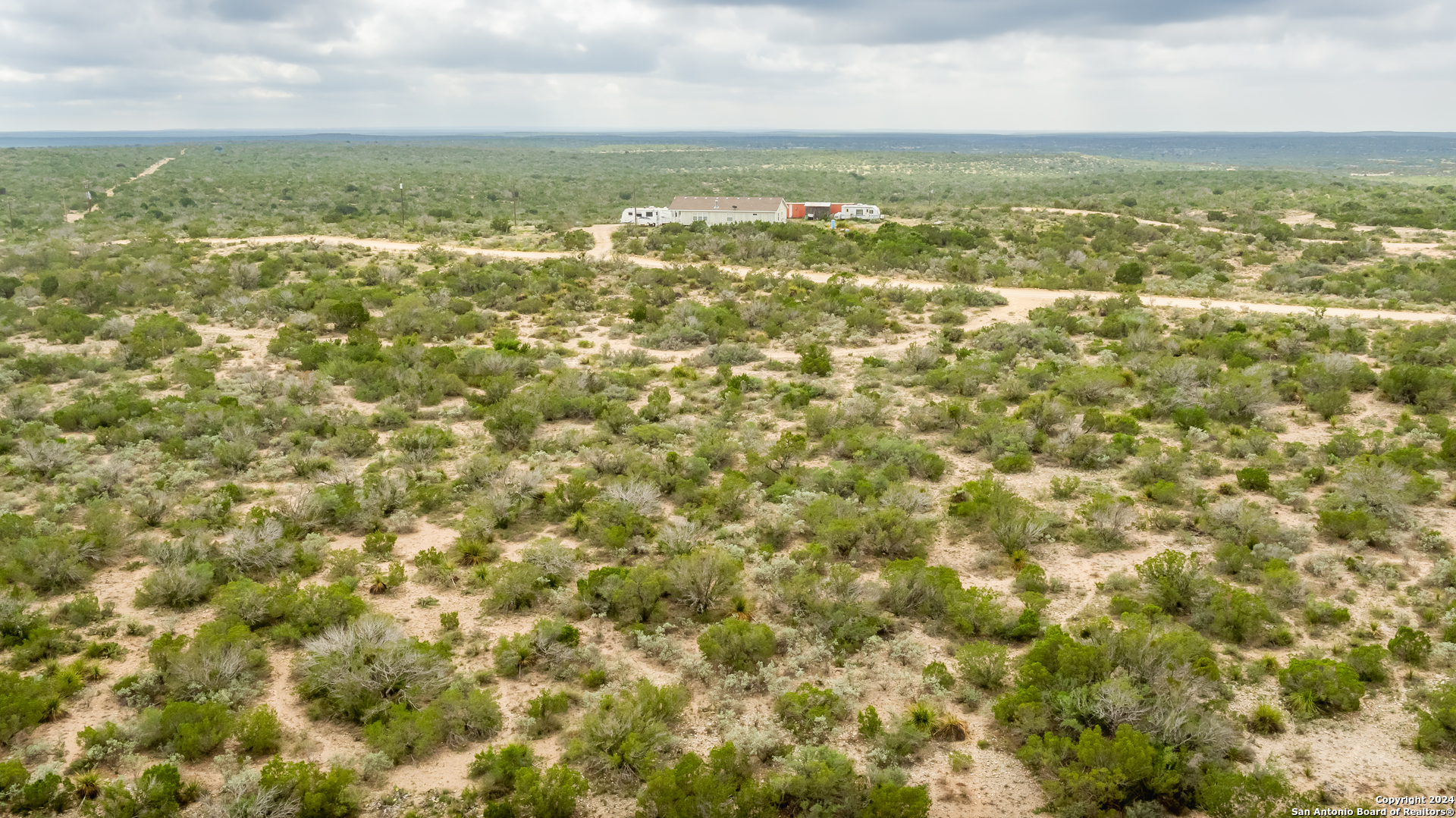 Tbd Ward Ranch Road Comstock, TX 78837 - Photo 19 of 20 an aerial view of residential houses with outdoor space and trees