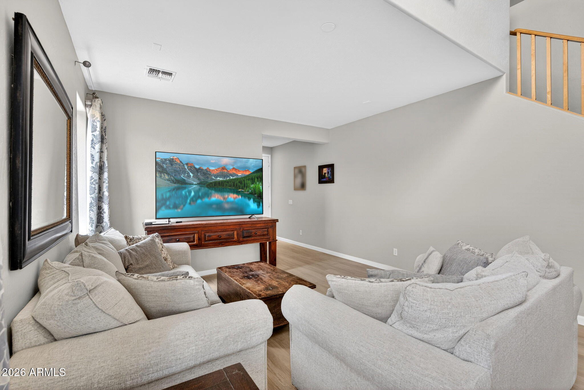 6280 South Sinova Court Gilbert, AZ 85298 - Photo 6 of 64 a living room with furniture and a flat screen tv