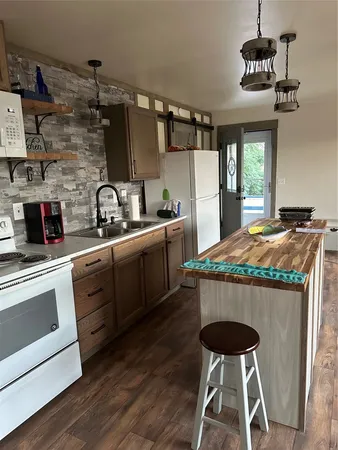 a kitchen with a stove and cabinets