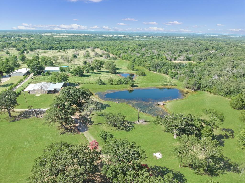 1001 Sandy Ridge Road Scurry, TX 75158 - Photo 8 of 35 Expansive property featuring two distinct ponds, mature trees, and vast green spaces