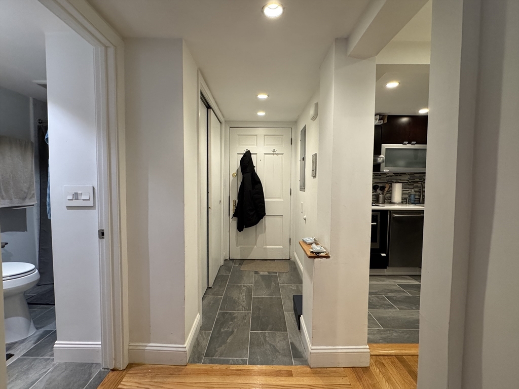 124 Beacon Street, Unit GF Boston, MA 02116 - Photo 6 of 11 a view of hallway with walk in closet and bathroom