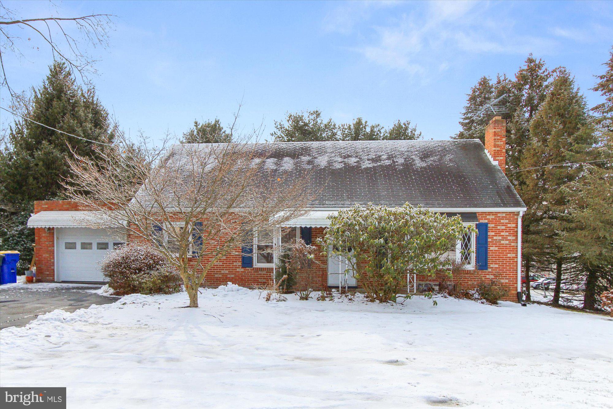 222 Dew Drop Road York, PA 17402 - Photo 1 of 31 a front view of a house with a yard covered with snow in front of house