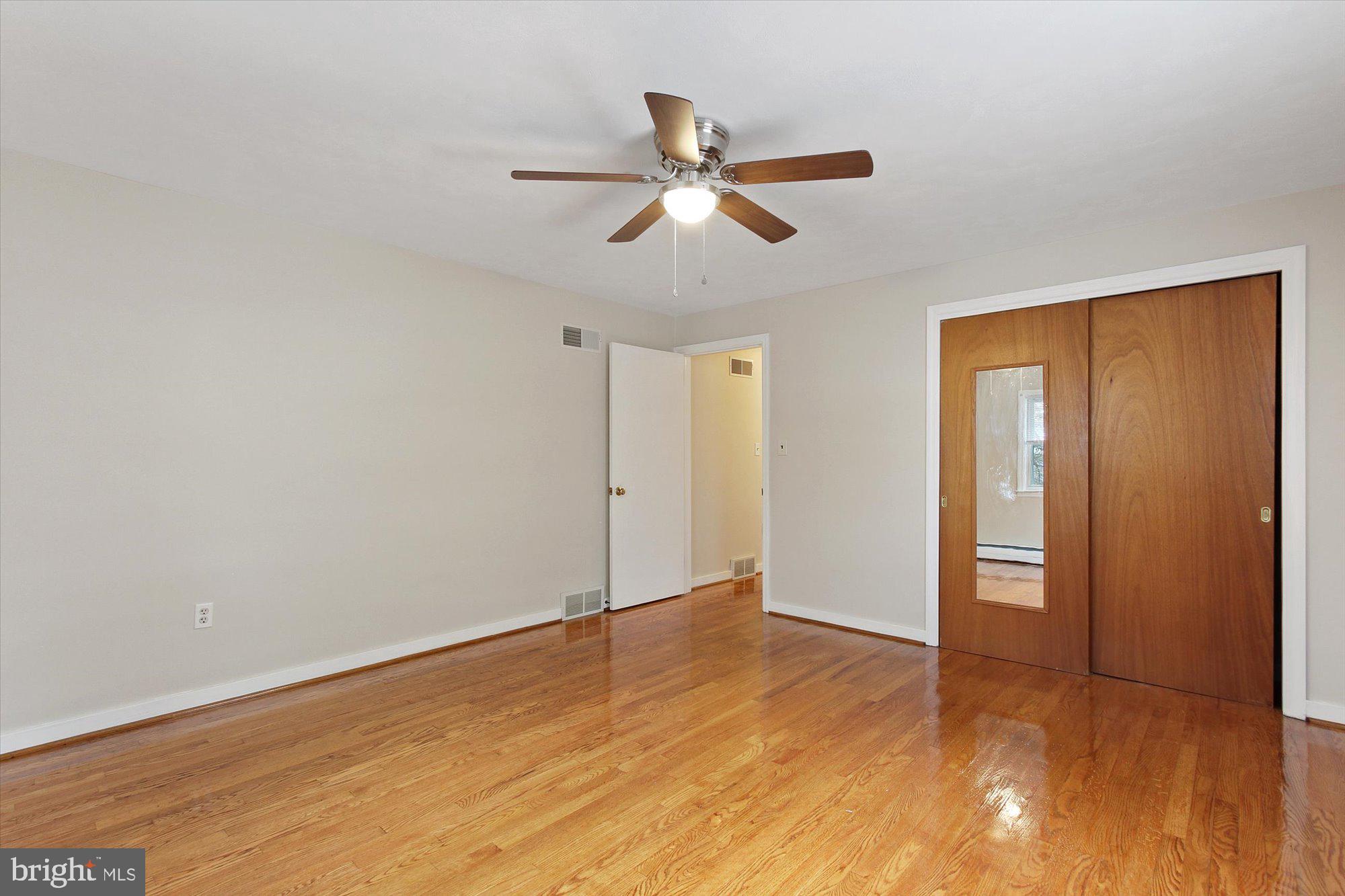 222 Dew Drop Road York, PA 17402 - Photo 12 of 31 a view of empty room with wooden floor