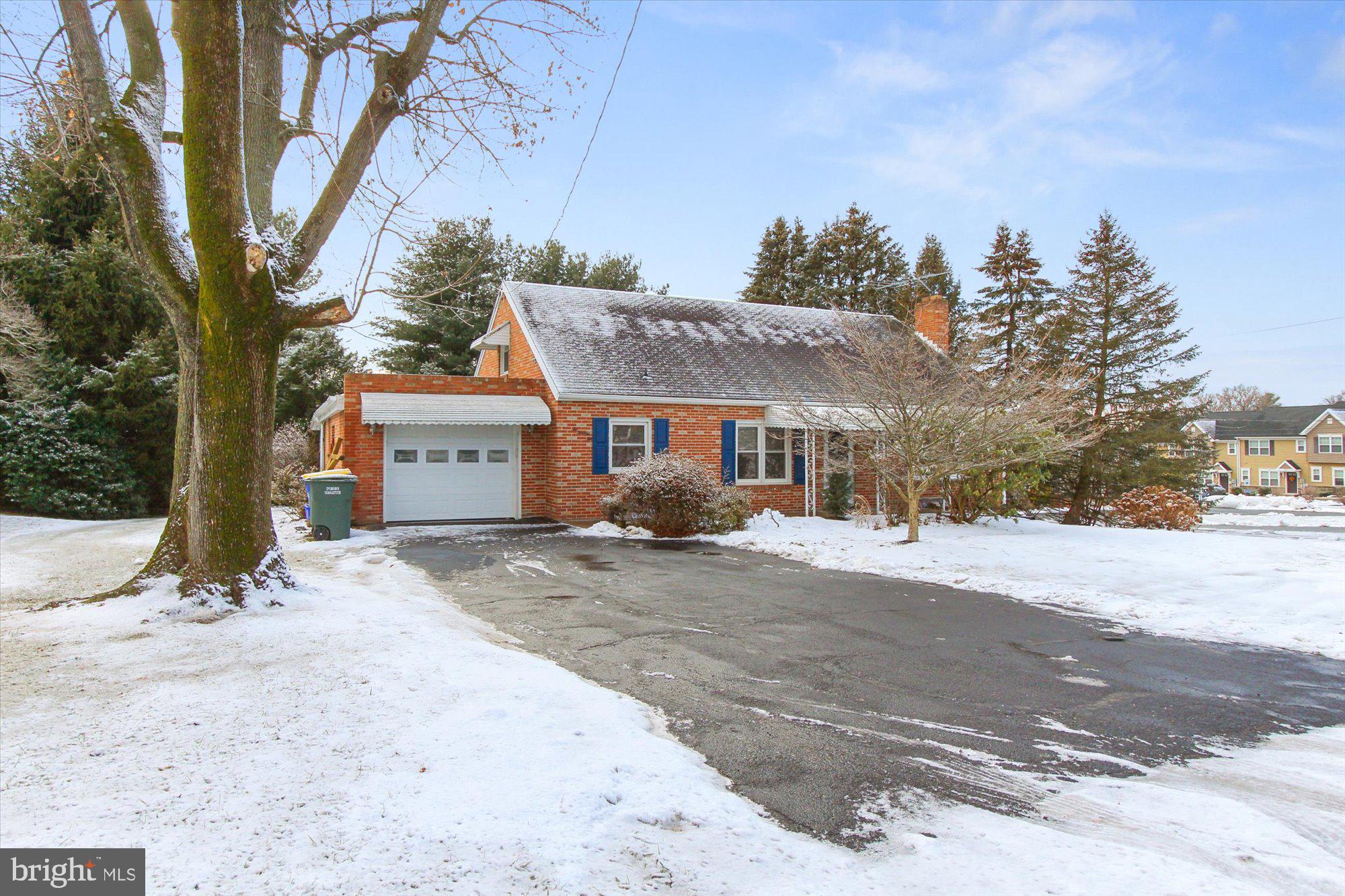 222 Dew Drop Road York, PA 17402 - Photo 2 of 31 a front view of a house with a yard covered in snow