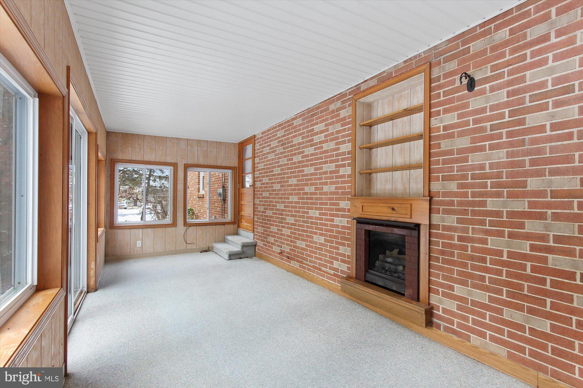 222 Dew Drop Road York, PA 17402 - Photo 22 of 31 a view of an empty room with a fireplace and a window