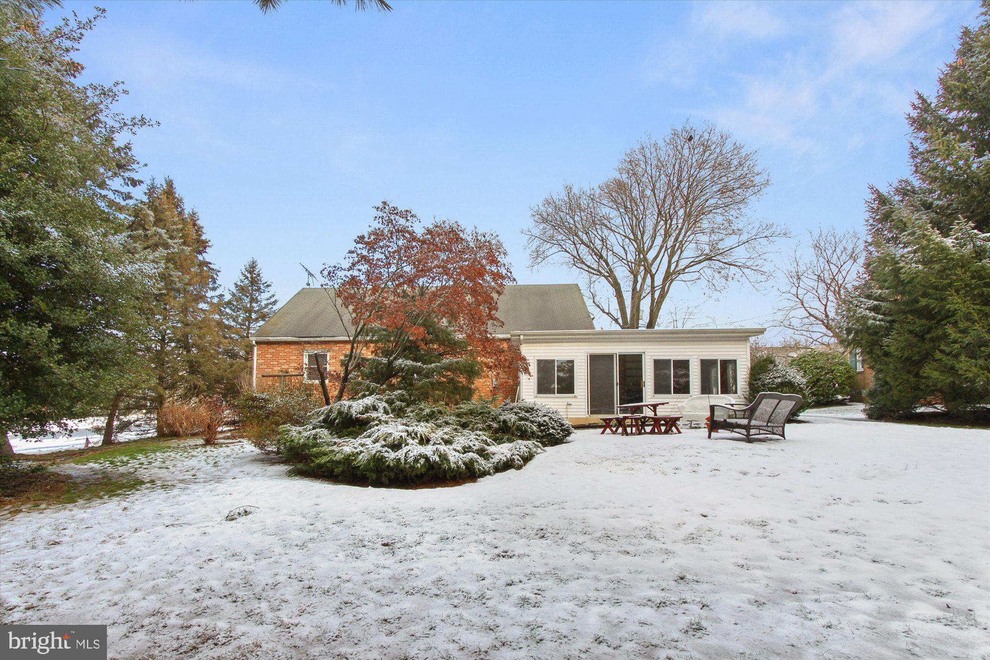 222 Dew Drop Road York, PA 17402 - Photo 27 of 31 a front view of a house with a yard covered with snow and cars parked