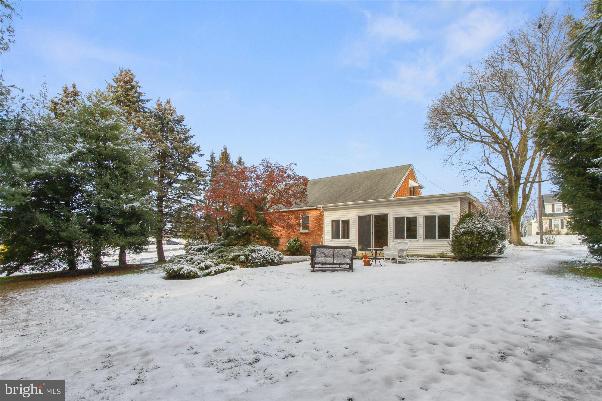 222 Dew Drop Road York, PA 17402 - Photo 28 of 31 a view of a white house with a yard covered in snow