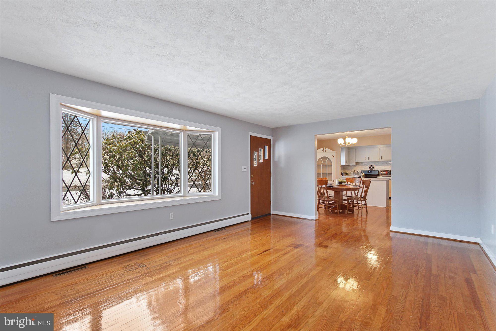 222 Dew Drop Road York, PA 17402 - Photo 5 of 31 wooden floor in an empty room with a window